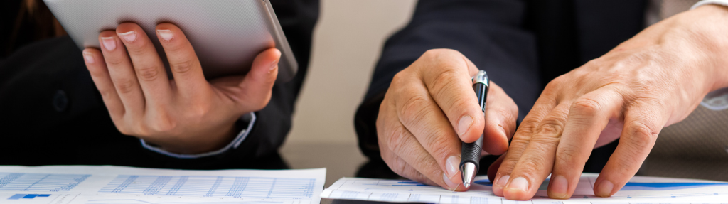 two business people checking documents