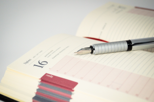 Image of a calendar and pen